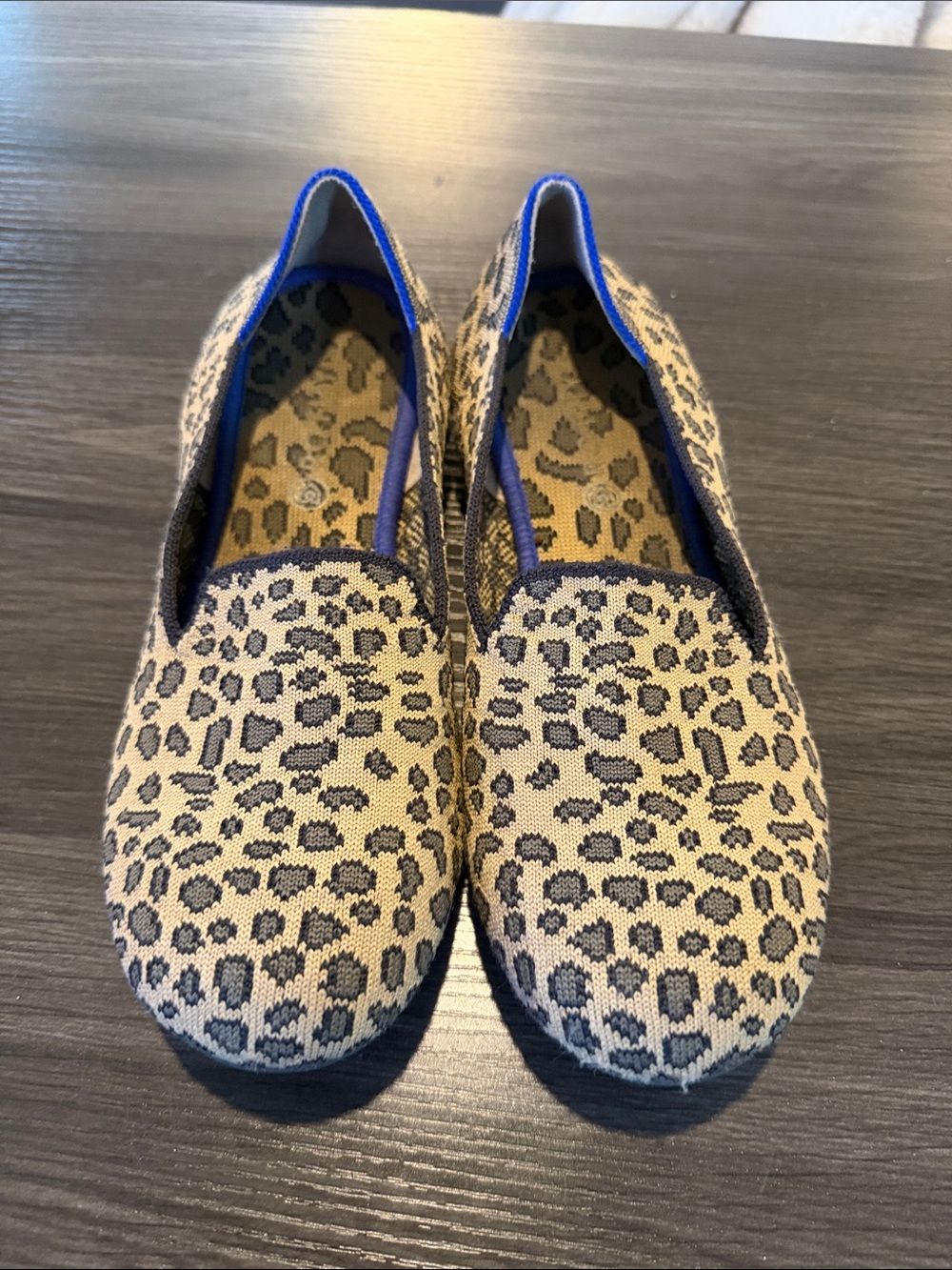 Rothy's Leopard Print Slip-On Flats in Beige and Black with Blue Trim